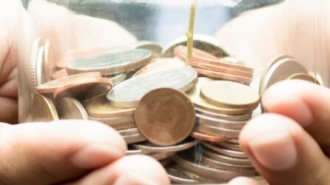 Business People Holding Glass Money Jar