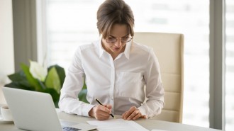Business woman signing a document
