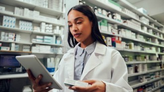 Woman chemist checking the medicine