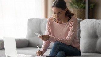 Woman Calculating VAT