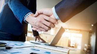 Shaking hands on dissolving a company