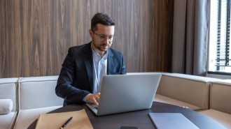 Business director working on laptop