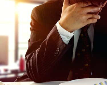 Businessman Struggling With Debt