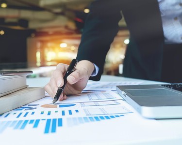 Businesswoman Looking At Her Financial Assets
