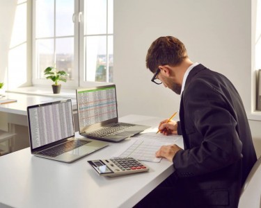 Business man doing his accounts