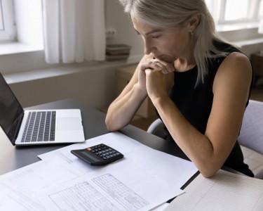 Woman looking at her tax bills