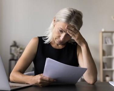 Upset woman with a document