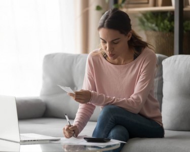 Woman Calculating VAT