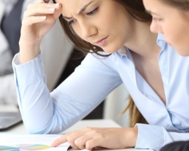Two Worried Businesswomen With Cash Flow Problems