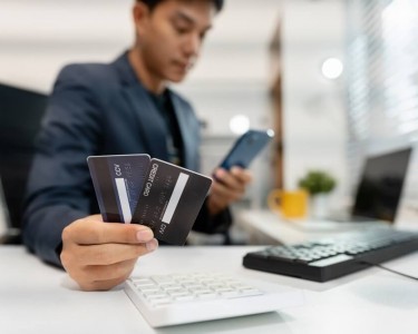Businessman sorting debts