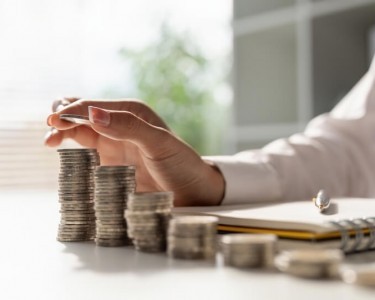 Woman stacking money