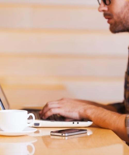 Man Typing Laptop